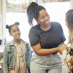 mom-greeted-teacher-at-parent-engagement-event